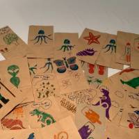 Completed lunch bags decorated by CECI faculty and staff members pile #1